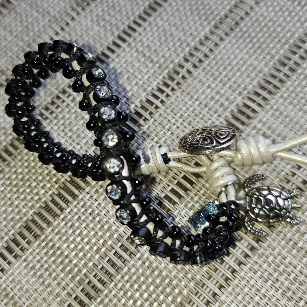 Bracelet with Rhinestones Set in Black Beads with White Tie and Turtle Charm - Picture 4 of 9